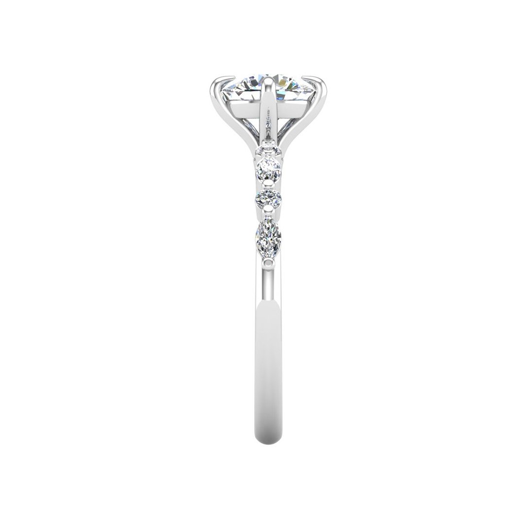 Yvarelle Petite Side Stone Engagement Ring in white gold with a round center stone, side view